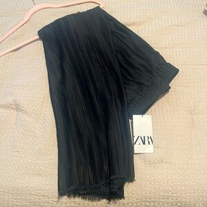 Black pleated dress pants.